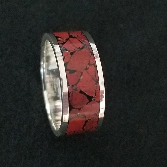 Red jasper inlay ring with sterling silver core and black background