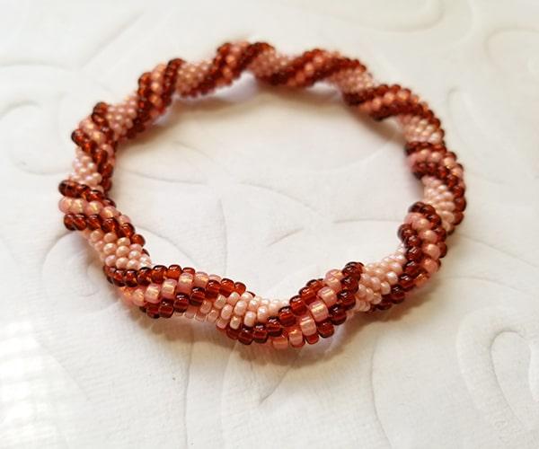 Bead crochet bracelet twist pattern in brown & peach