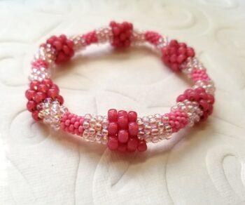 Bead crochet bracelet with multiple size beads in pink
