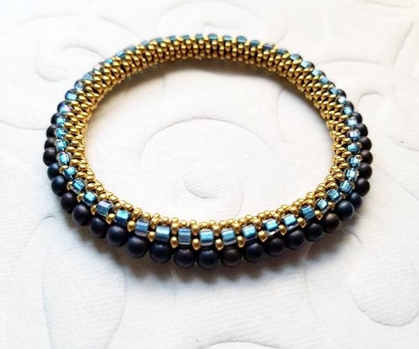 Bead crochet bracelet in blues & yellows