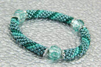 Teal segmented bead crochet bracelet with glass focal beads