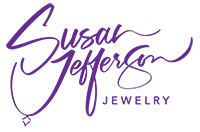 Susan Jefferson Jewelry's logo in purple handwritten font