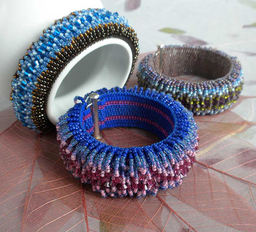 Beaded cuff bracelet with loops and loops of beads and swarovski crystals. Designed by Karmen Schmidt