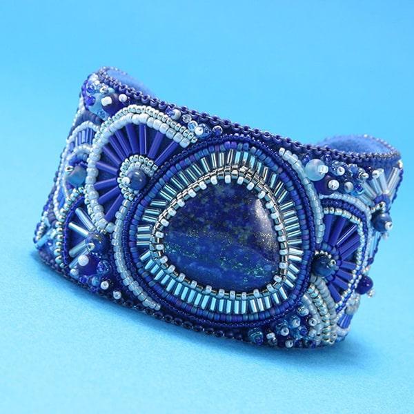 Wide bead embroidered cuff with lapis lazuli focal stone