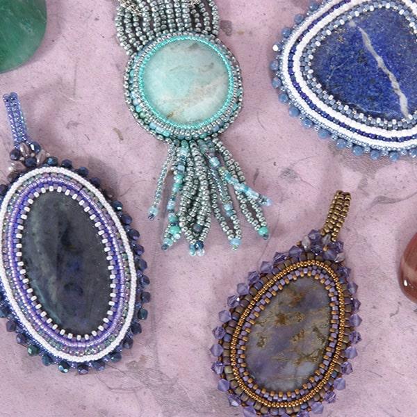 Several bead crocheted pendants in various colors and styles