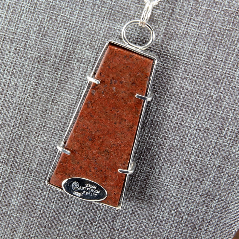Sterling silver, stone canyon jasper, and granite intarsia stone pendant
