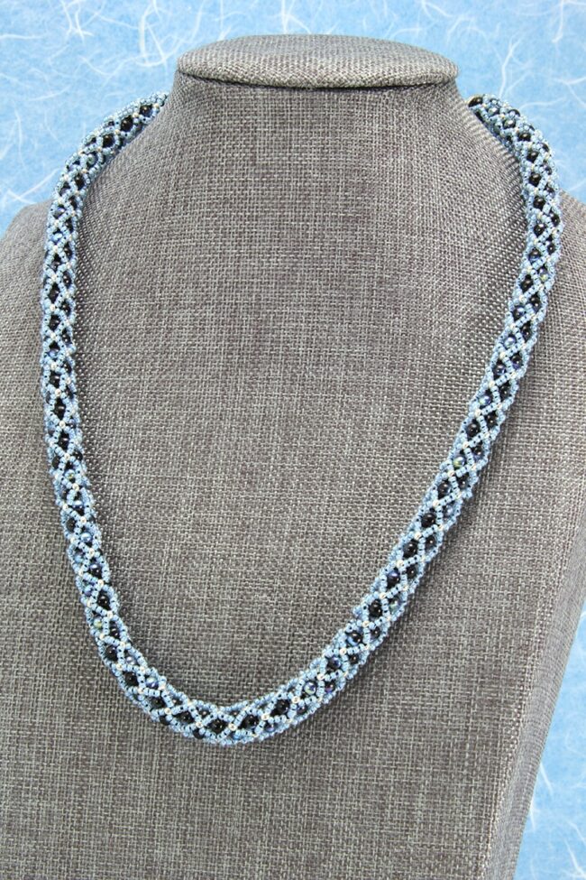 Light blue and black beaded netted necklace