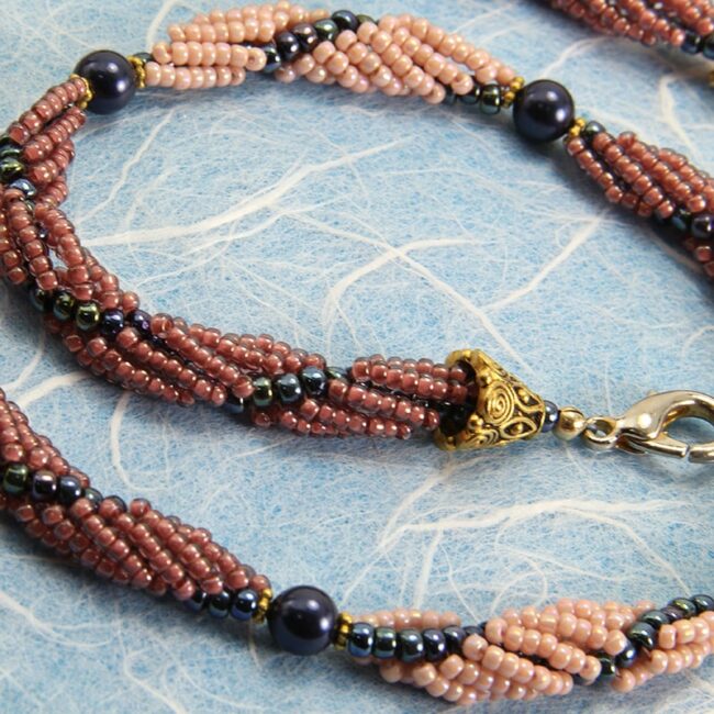 Navy blue and peach spiral rope beaded necklace