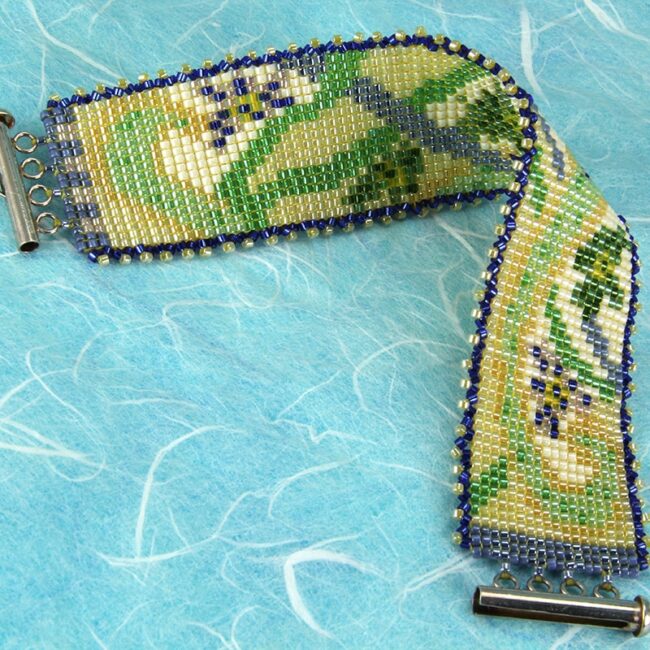 Square stitch beaded bracelet with flower and vine pattern