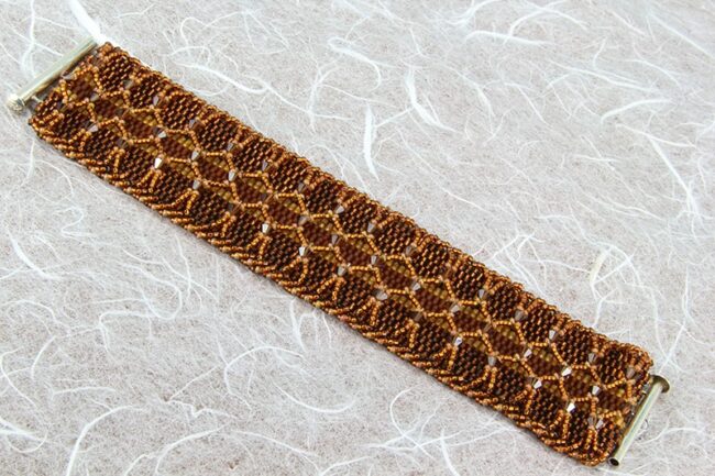 Peyote stitch beaded bracelet in copper with layered netting