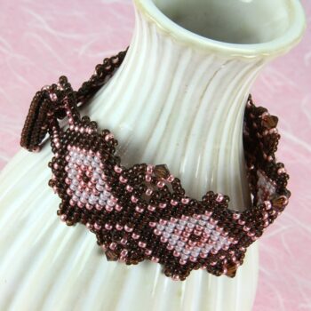 Beaded bracelet in brown and pink embellished with Swarovski crystals