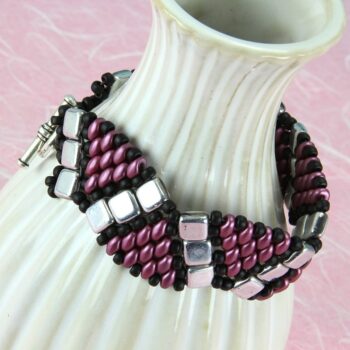 Beaded bracelet in black, silver, and plum