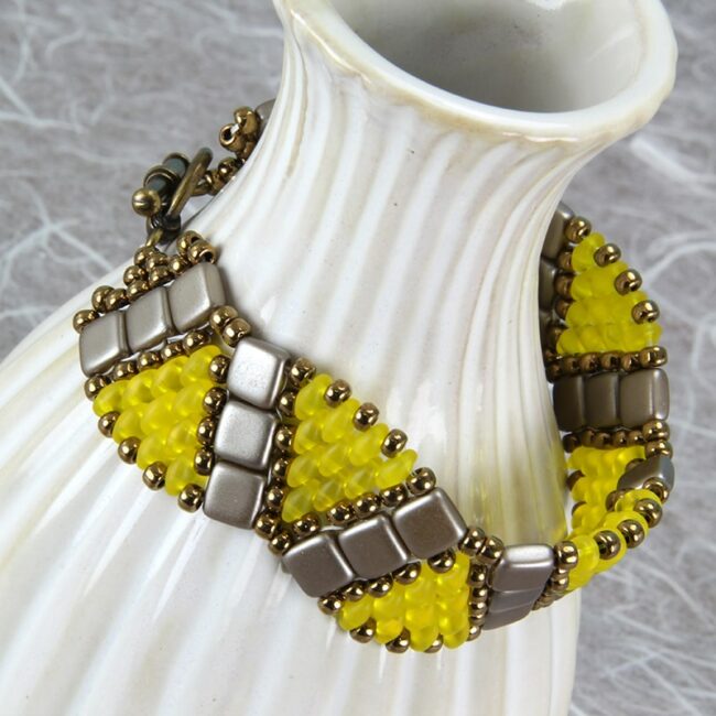 Beaded bracelet in brown, taupe, and yellow