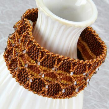 Peyote stitch beaded bracelet in copper with layered netting